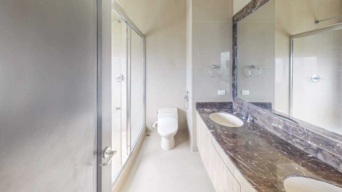 Modern children playroom colorful furniture floor to ceiling windows ocean & city views in luxury PH Ocean Drive Panama City