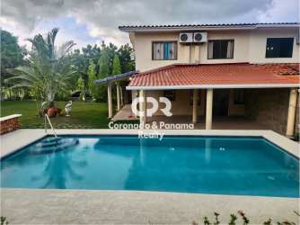 Large covered outdoor terrace facing pool at duplex house Club Ecuestre Coronado