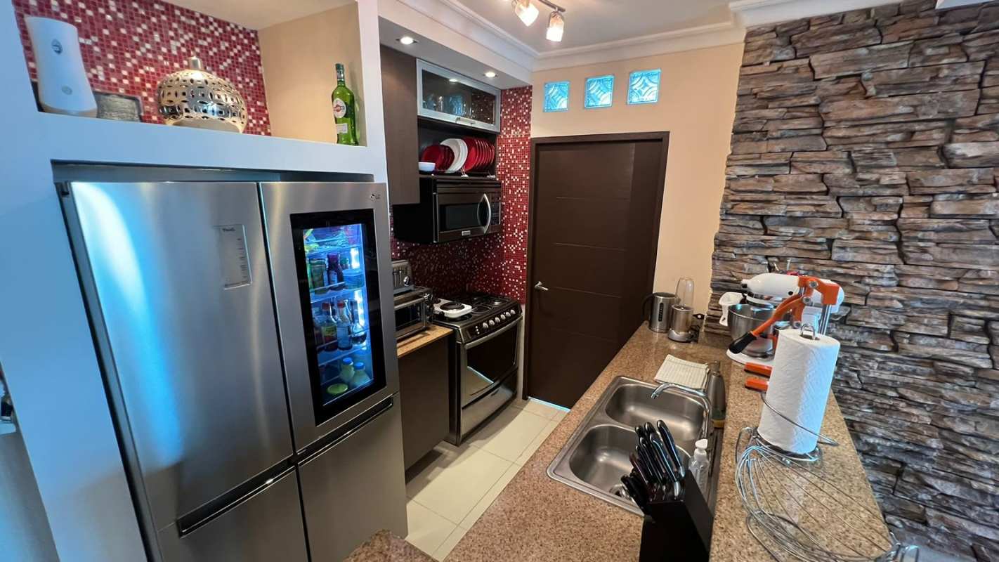 Bedroom with mirrored wardrobes, split AC and minimalist design in PH Pacific Sun Panama