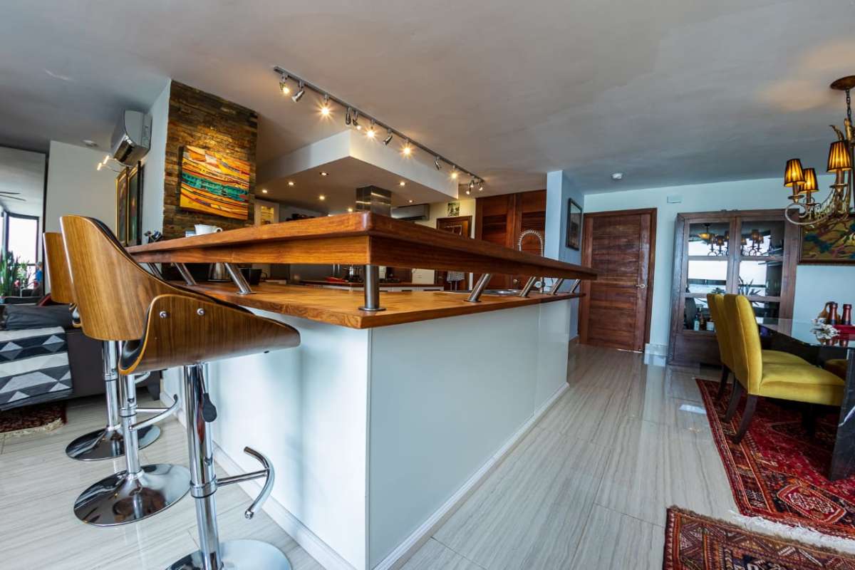 Dining area with panoramic sea views and access to the balcony at PH Coral Reef Panama City