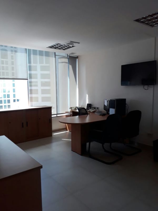 Interior of private commercial office with large windows and corporate furnishings in Obarrio Tower, Panama City