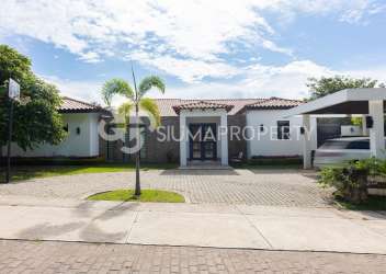 Mediterranean style villa with tile roof, covered entrance, gardens Punta Barco Panama