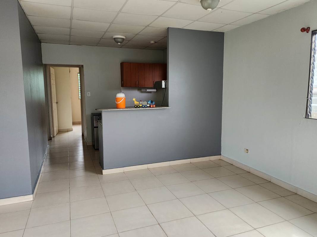 Bright living and dining room with ceramic tile floor and open kitchen in Brisas del Lago Panama City