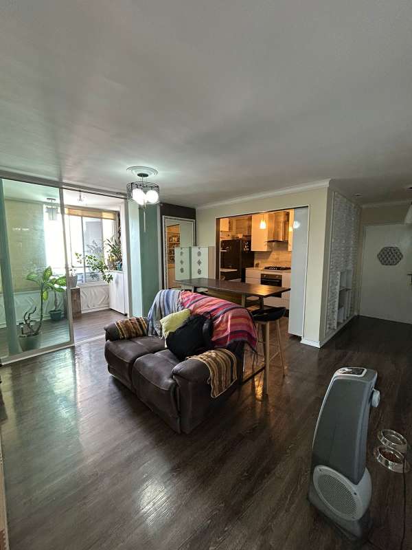 Contemporary kitchen with built-in appliances, white cabinets at Edison Park Panama apartment