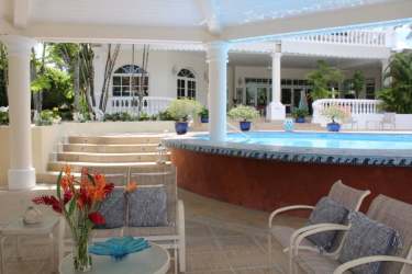 Covered terrace with seating, swimming pool, Mediterranean style luxury home in Coronado Panama