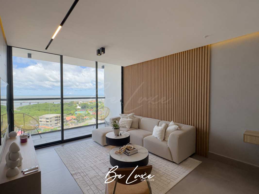 Luxury minimalist living room with balcony overlooking the Pacific at PH Victory Sport Panama