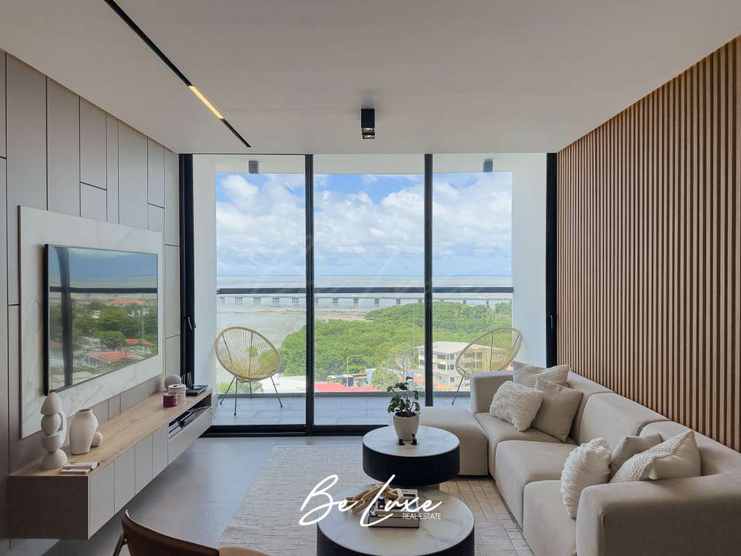 Open-concept living area with panoramic balcony and sea views Victory Sport Panama