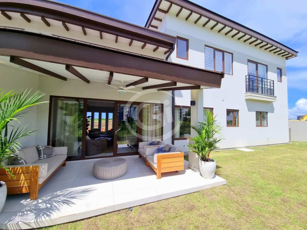 Modern kitchen with quartz countertops imported cabinetry large windows luxury house in Santa María Panama