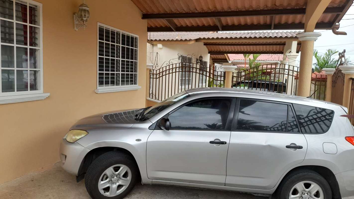 Covered carport fits two vehicles at corner house Brisas del Golf Panama