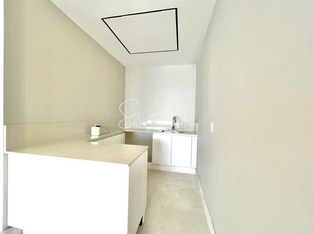 Gourmet kitchen with large island, custom cabinets and ocean views at Ocean Reef Island Panama