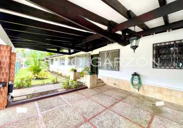Spacious terrace patio covered outdoor living garden view at Howard house Panama
