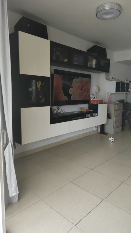 Living area with modern entertainment wall and large windows in PH Rivage Marbella Panama