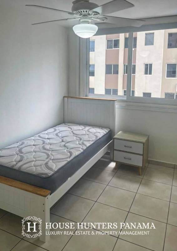 Minimalist bedroom with window, closet space, tile floors in PH Torres del Mar del Sur San Francisco Panama