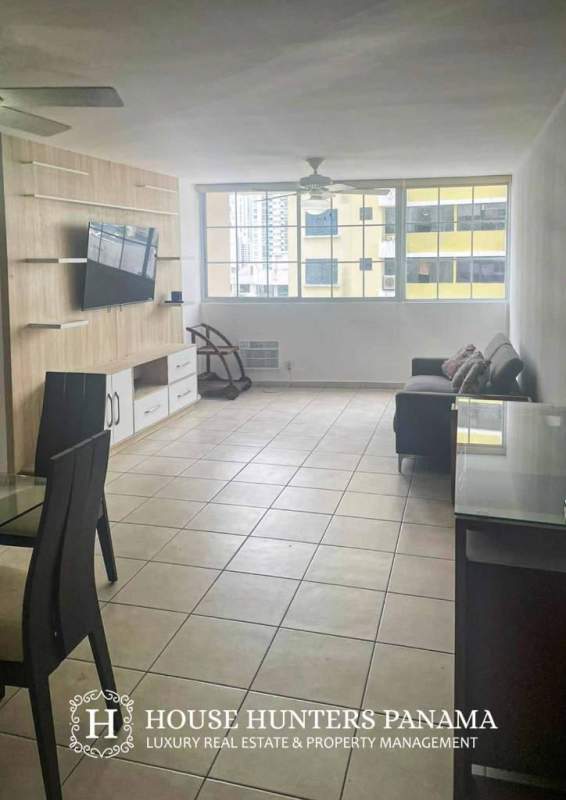 Bright living-dining room with tile floors and balcony in PH Torres del Mar del Sur Panama City