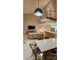 Elegant bedroom in luxury loft overlooking golf course and gardens in Buenaventura Puntarena Panama