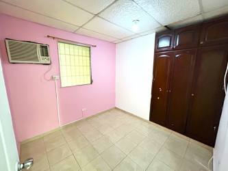 Simple bedroom with AC tiled floors built-in wardrobe Villas del Carmen Panama