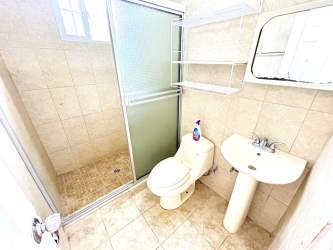 Contemporary bathroom glass shower enclosure tiled walls Villas del Carmen La Chorrera