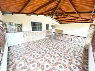 Covered exterior patio with railing tiled floor Villas del Carmen La Chorrera