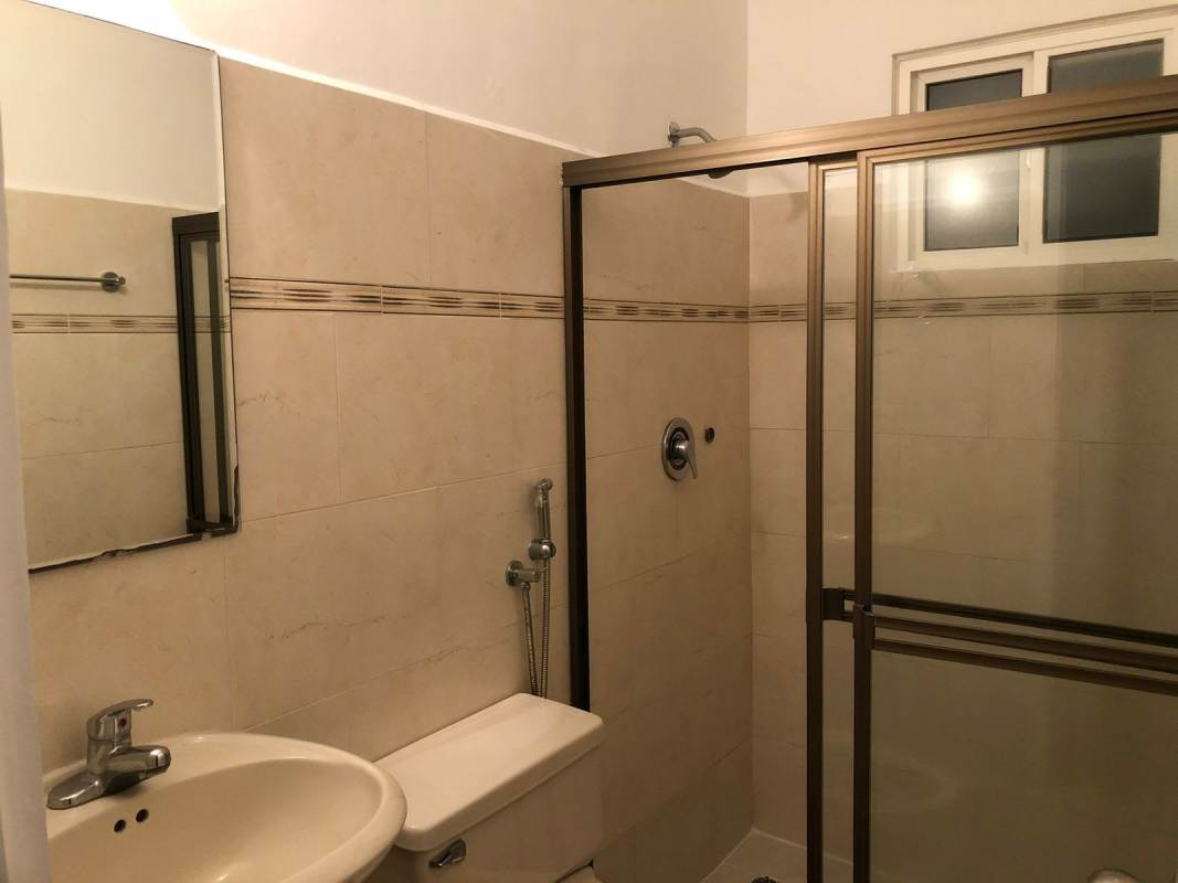 Bathroom with glass shower enclosure and modern fixtures Villas del Golf