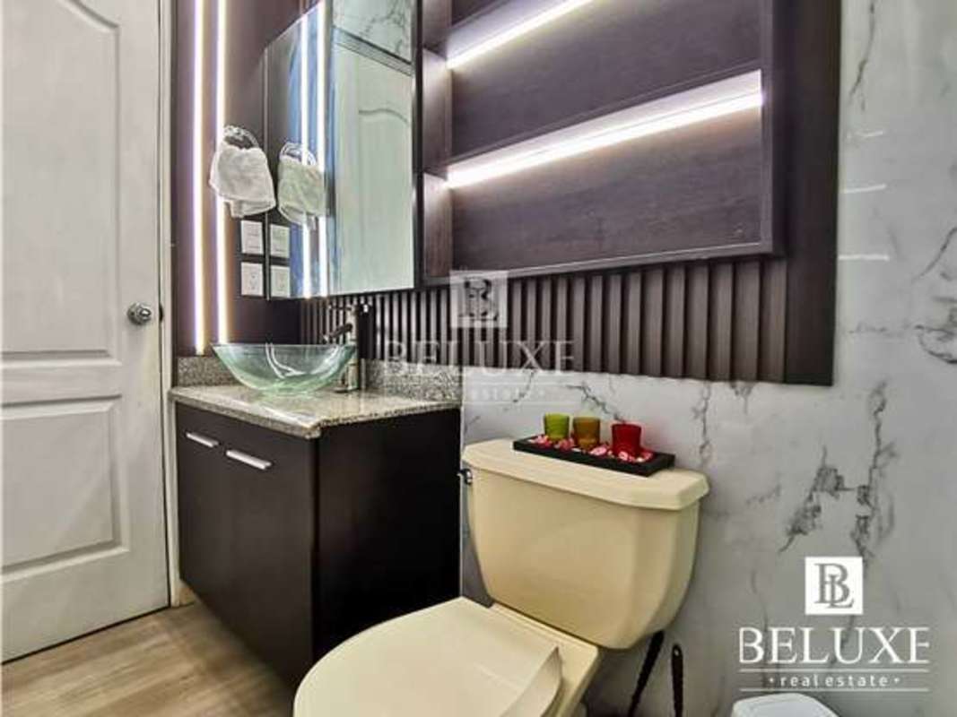 Updated bathroom with glass vessel sink granite counter in PH Majestic Garden Edison Park Panama City