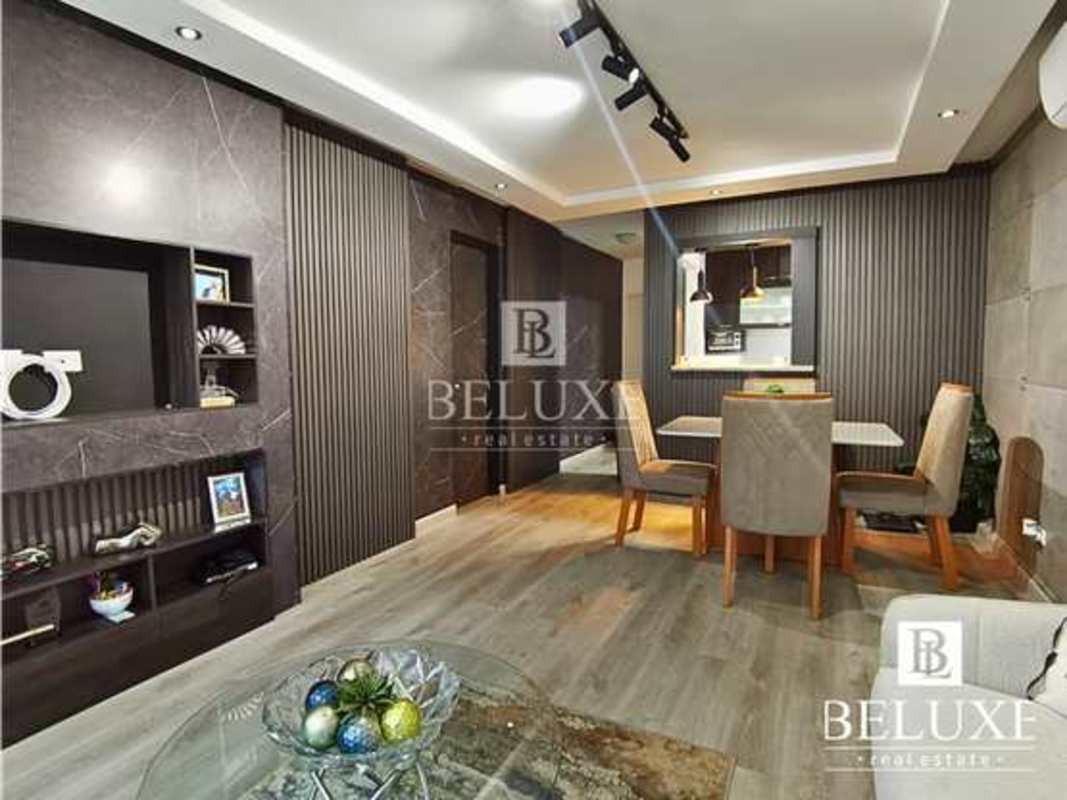 Modern gym with equipment and large windows overlooking city in PH Majestic Garden Panama