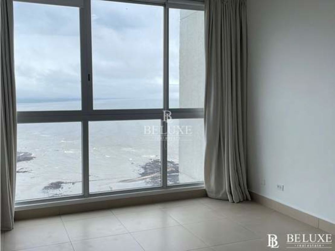 Bedroom with large windows panoramic ocean view PH Oceanaire luxury condo Panama City