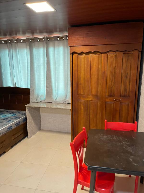 Compact studio apartment with tiled floor, wooden wardrobe, dining space in Panama City