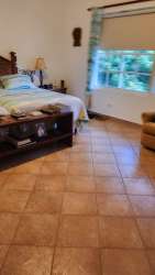 Traditional bathroom with blue decorative tiles, pedestal sink at Playa Serena Coronado beach villa