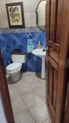 Bathroom with shower, light tiles, bidet spray, Playa Serena beachfront home
