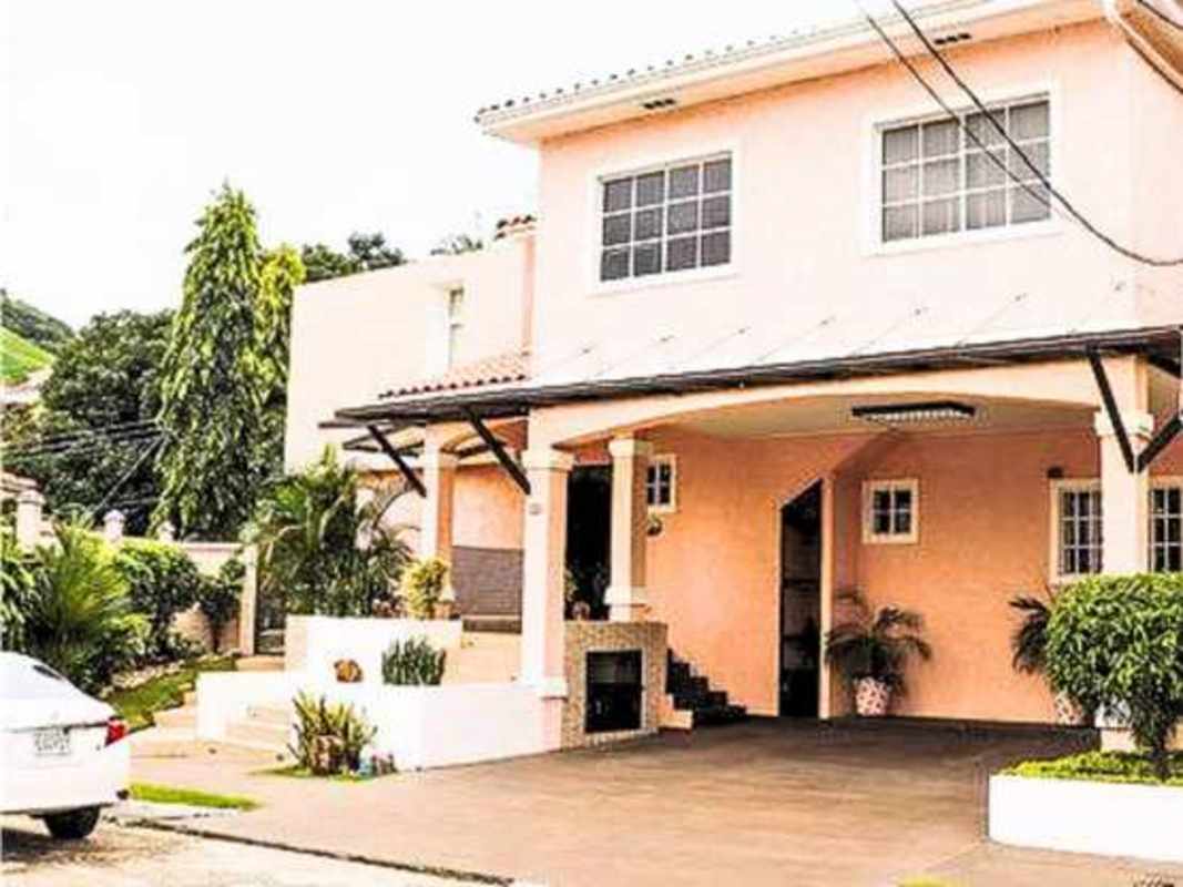 Private swimming pool with slide tropical landscaping outdoor entertaining BBQ bar corner home Altos de Panamá Panama