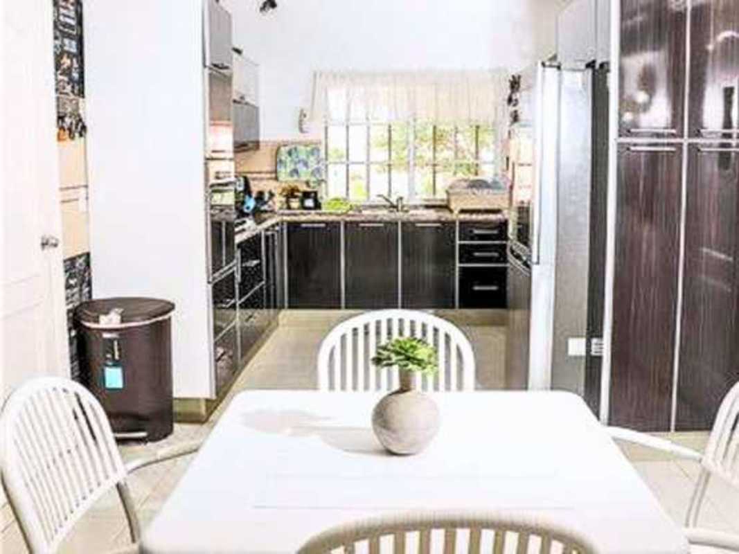 Living room space with porcelain floors bright natural light terrace access in large corner house Altos de Panamá