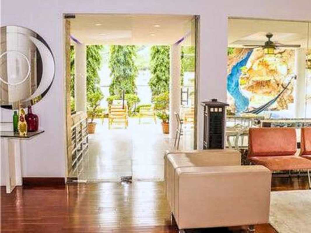 Spacious bedroom with balcony large window porcelain tile floors corner house Panama City