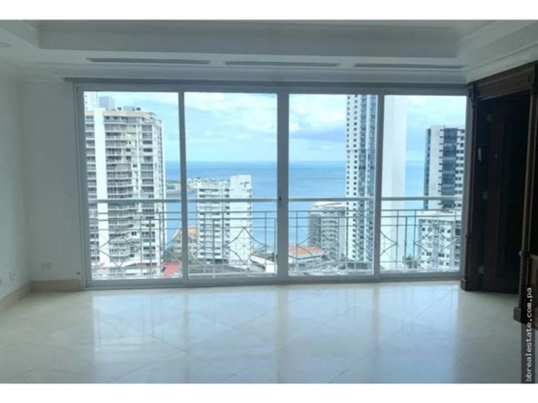 Bedroom interior offering views of ocean and skyline from PH City Tower