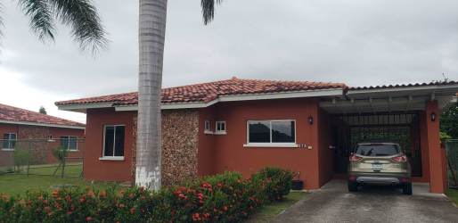 Bright traditional bedroom with large windows, wooden closet and garden views in Villas de la Colonia beach house