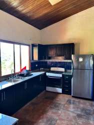 Swimming pool with balcony and tropical landscaping at mountain house in Altos del María Panama