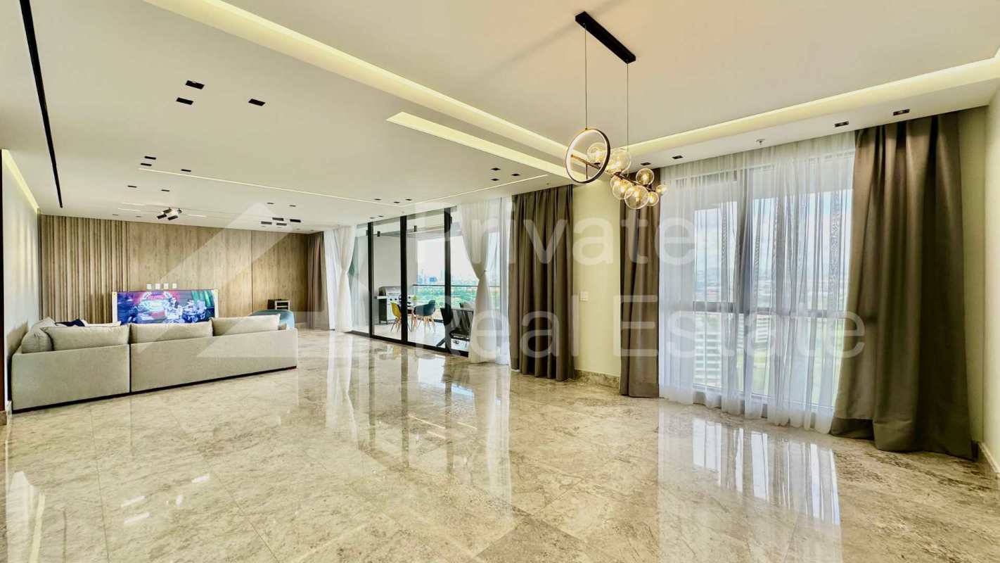 Upscale kitchen with elegant cabinetry, quartz countertops, premium appliances in PH Empire Santa María