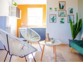 Bright colorful living area with sofa and decor in Rio Hato aparthotel apartments
