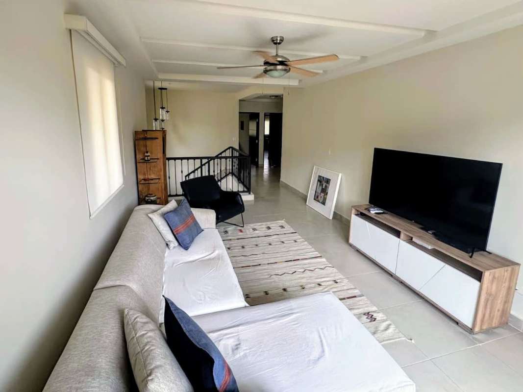 Living room with sofa and entertainment area Embassy Club luxury house Panama