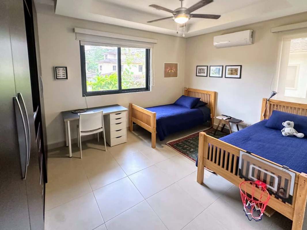 Kids room with twin beds and large window Embassy Club Panama house
