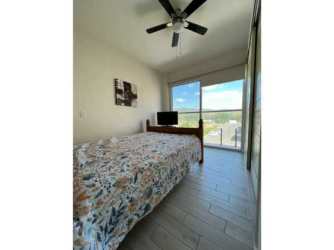 Spacious master bedroom with balcony and ocean view in Playa Caracol PH Ventanas del Mar