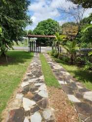 Traditional outdoor kitchen with covered roof ideal for BBQs and gatherings