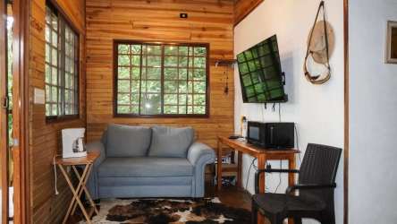 Mountain cabin kitchen with natural wood and tile design in Panama