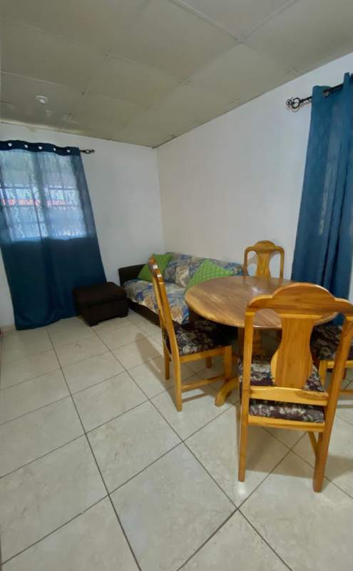 Simple bedroom with tiled floor, ceiling fan, and natural light for house in Los Álamos Pacora Panama