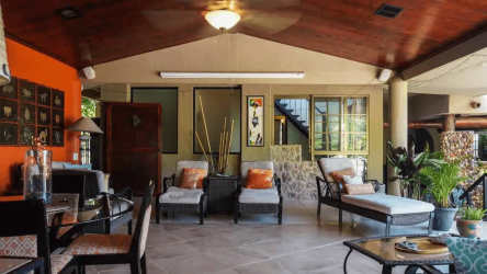 Large living room with vaulted wood ceilings, tropical decor in Mediterranean villa Altos del María Panama