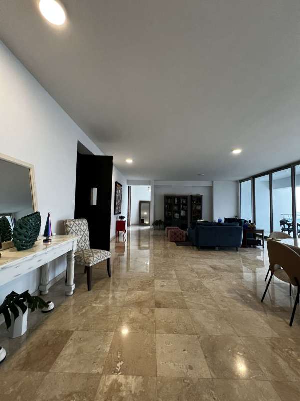 Formal marble floor living-dining with terrace and ocean views in PH Aqualina luxury apartment Punta Pacifica