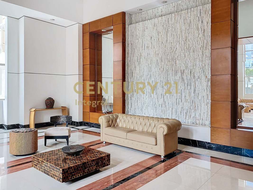 Spacious kitchen with granite counters, wooden cabinets in Pacific Point Punta Pacifica apartment