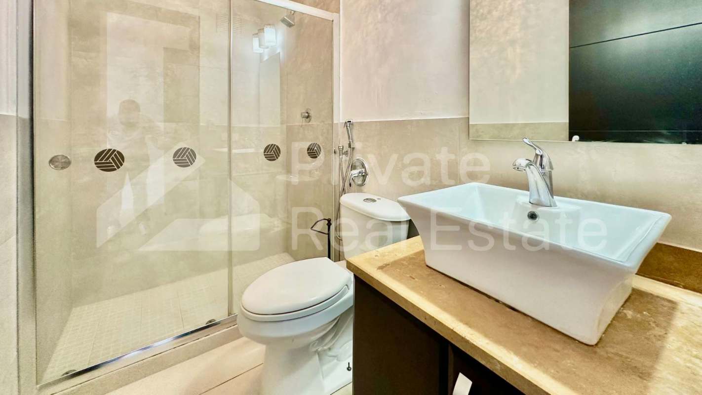 Upgraded marble-topped custom bar with wine fridge inside apartment PH Titanium Costa del Este Panama