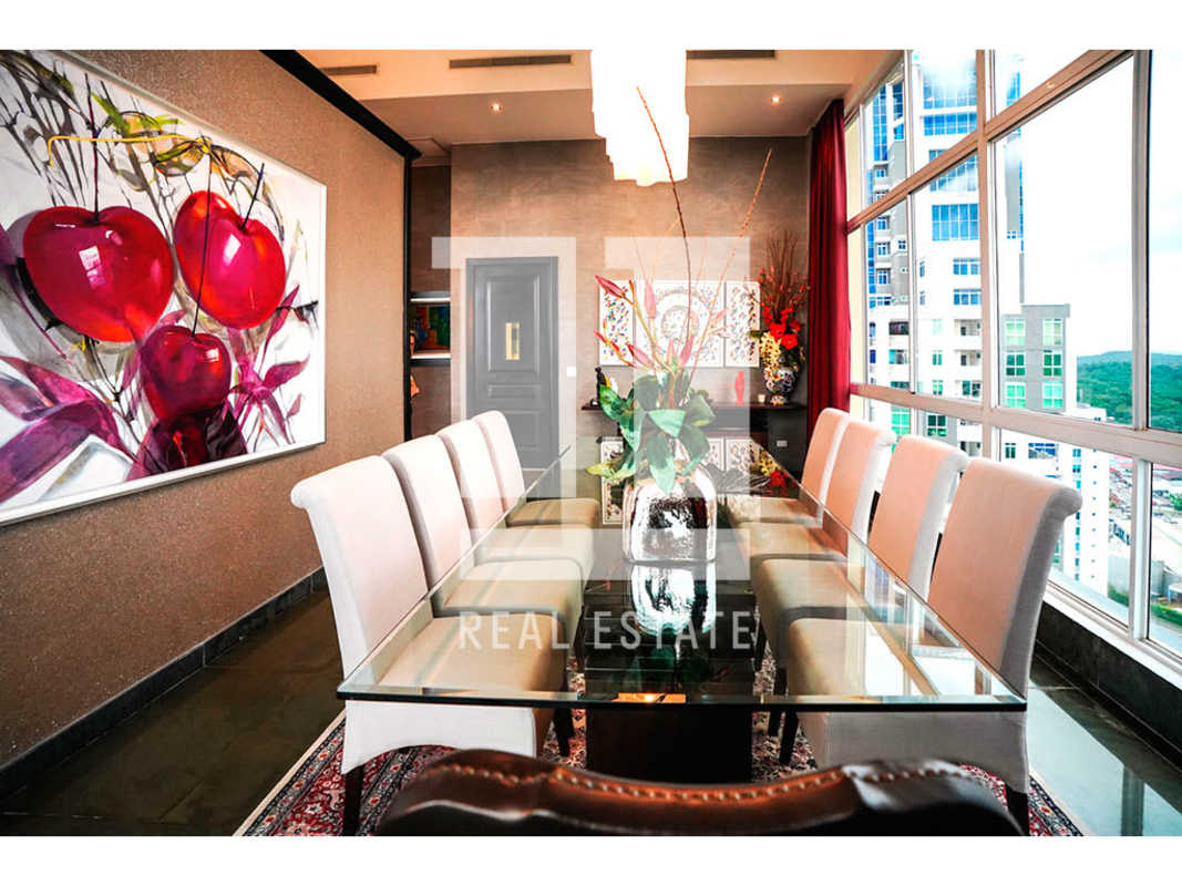 Granite kitchen with stainless appliances and tile backsplash PH Portanova Penthouse El Cangrejo Panama