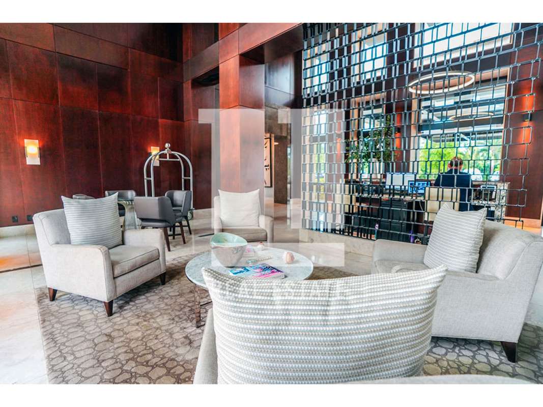 Elegant building lobby with designer finishes at Santa María Court East Panama luxury condo