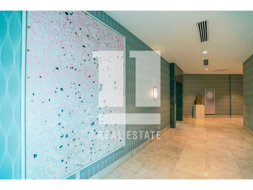 Master suite with floor-to-ceiling windows overlooking golf at Santa María Panama condo